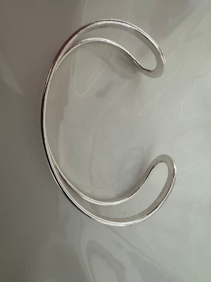 Bracelet manchette double bande en argent poli