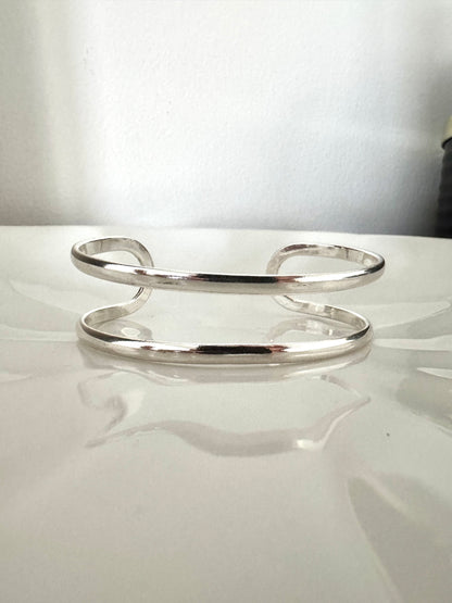Bracelet manchette double bande en argent poli