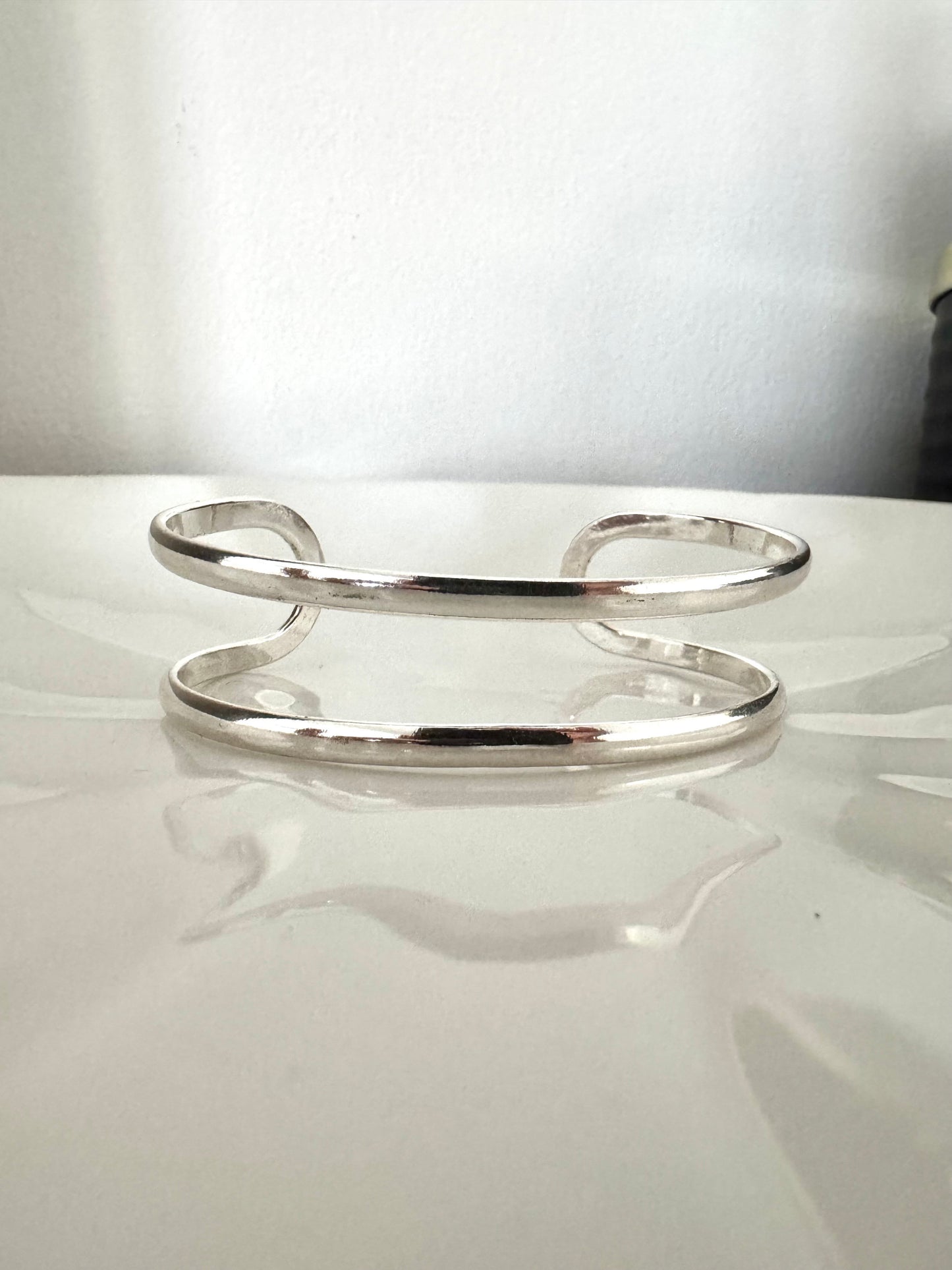 Bracelet manchette double bande en argent poli